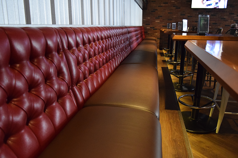 Red and black bench seating in a restaurant