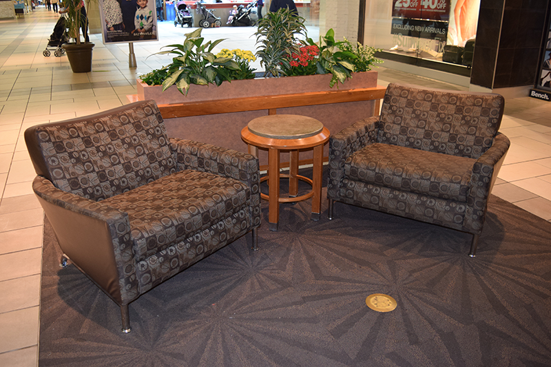 Two newly upholstered seats in a mall